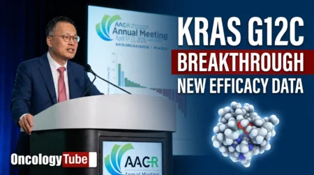 Dr. Byoung Chul Cho speaking at a podium during the AACR Annual Meeting 2026, presenting new efficacy data for KRAS G12C inhibitor alisertib (elisrasib).